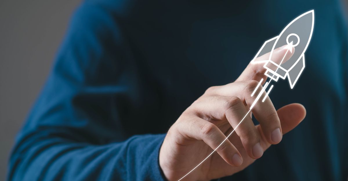 A person touching a digital rocket icon representing growth, symbolizing Scaling your business with Business Central.
