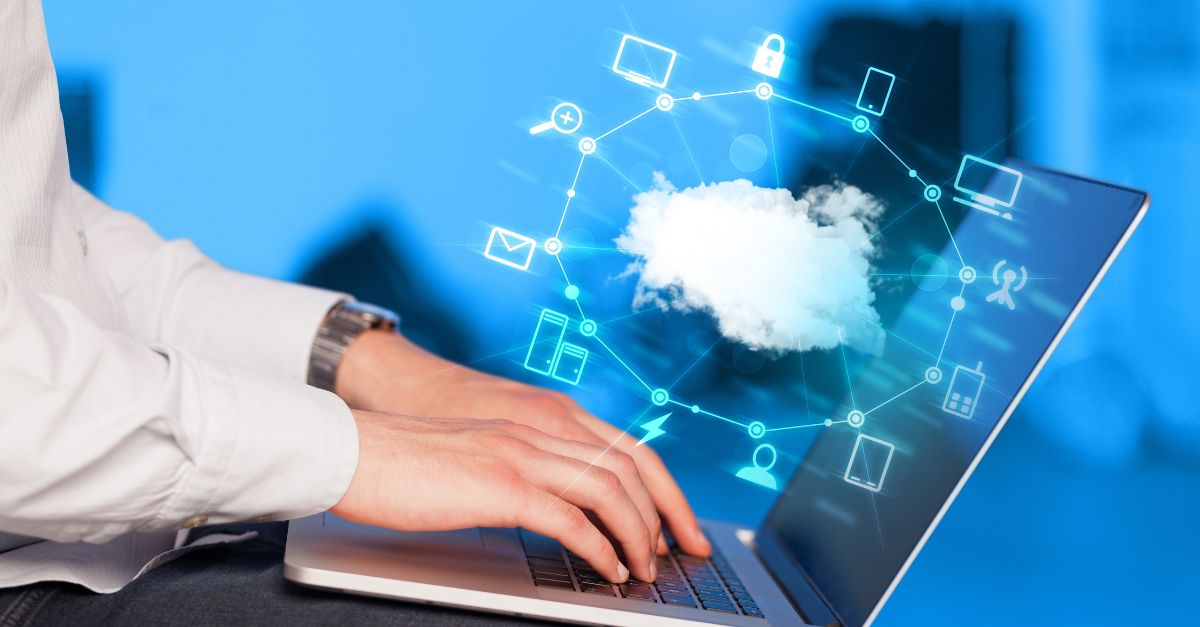 Copilot in Business Central visualized through a professional using a laptop with cloud-based Microsoft AI icons, representing secure data integration, automation, and intelligent ERP workflows.